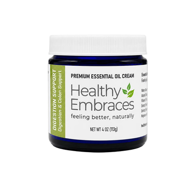 Healthy Embraces digestion support cream in a white jar, showing smooth cream texture and label on the front.