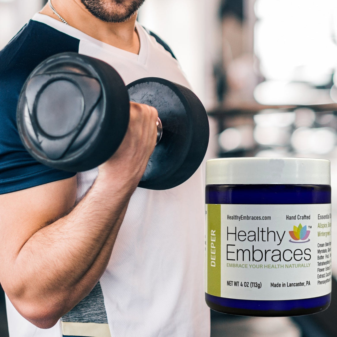 Person lifting a dumbbell with a container of 'Healthy Embraces' supplement in the foreground.