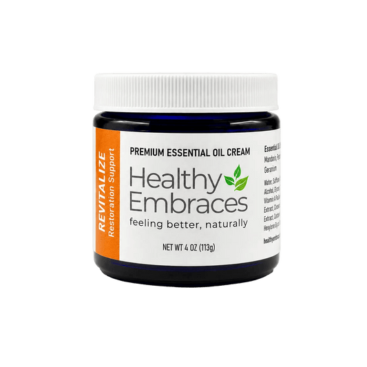 Healthy Embraces Revitalize Essential Oil Recovery Cream in a jar, designed for active lifestyles to refresh and support renewal.